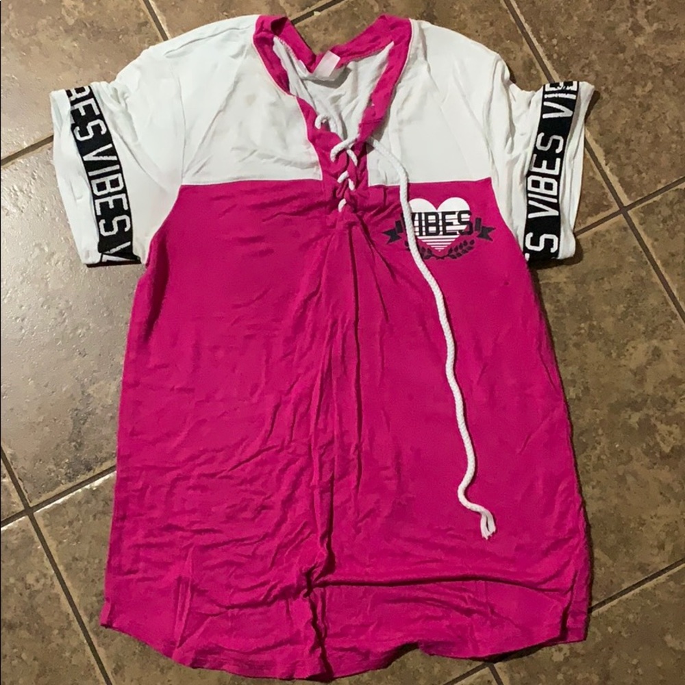 This white and pink shirt it says vibes on it